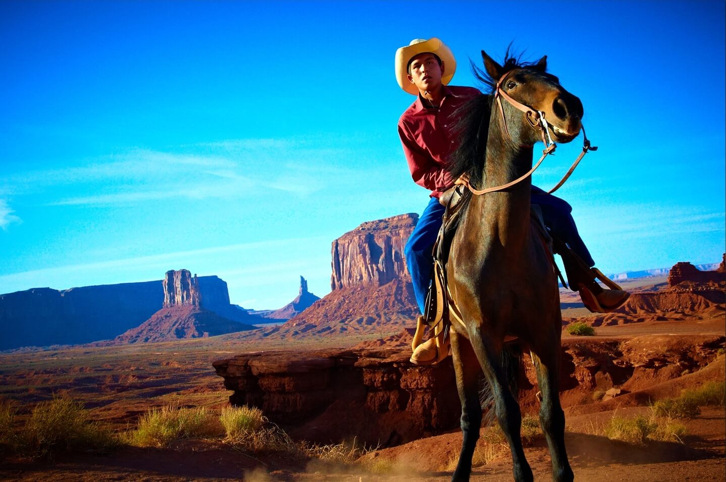 A Navajo man on horseback in Monument Valley