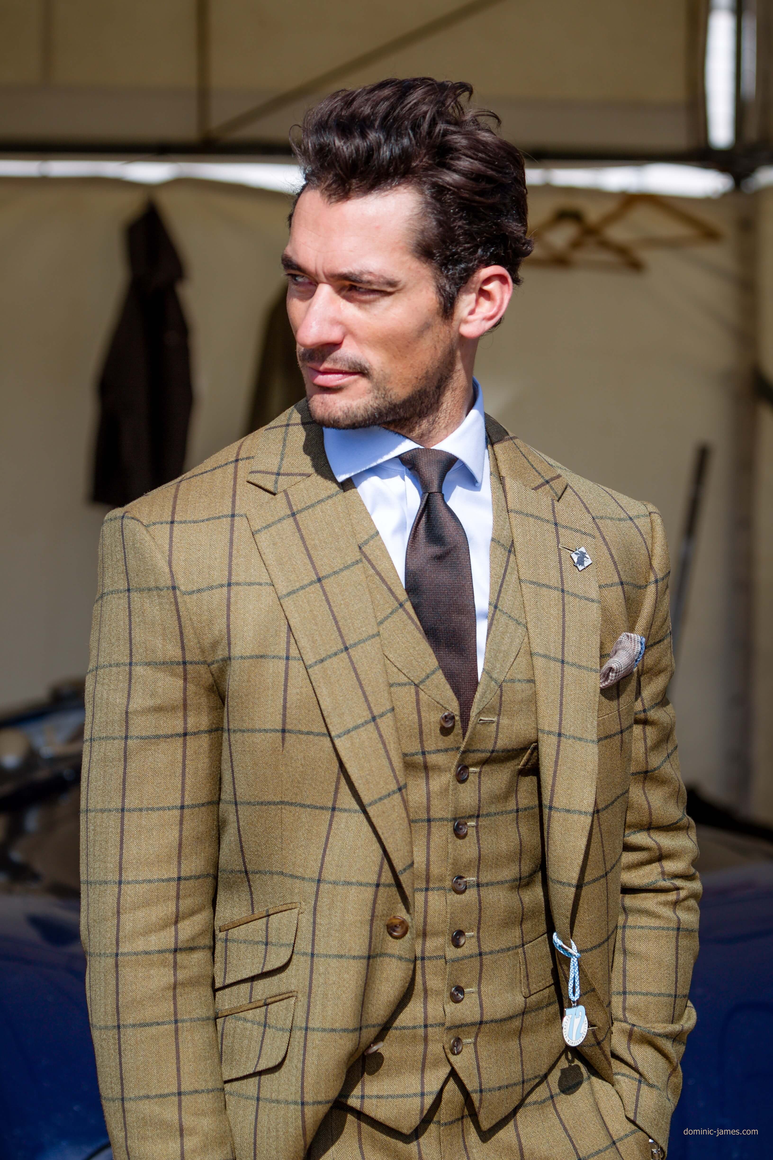 A sharp-dressed man looks over his shoulder