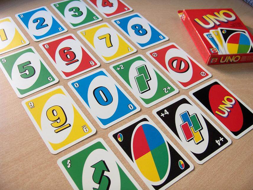 A set of sample UNO cards and the game box