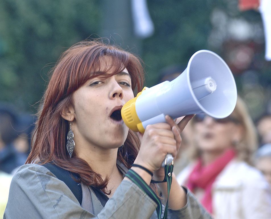 A woman with a megaphone at a protest