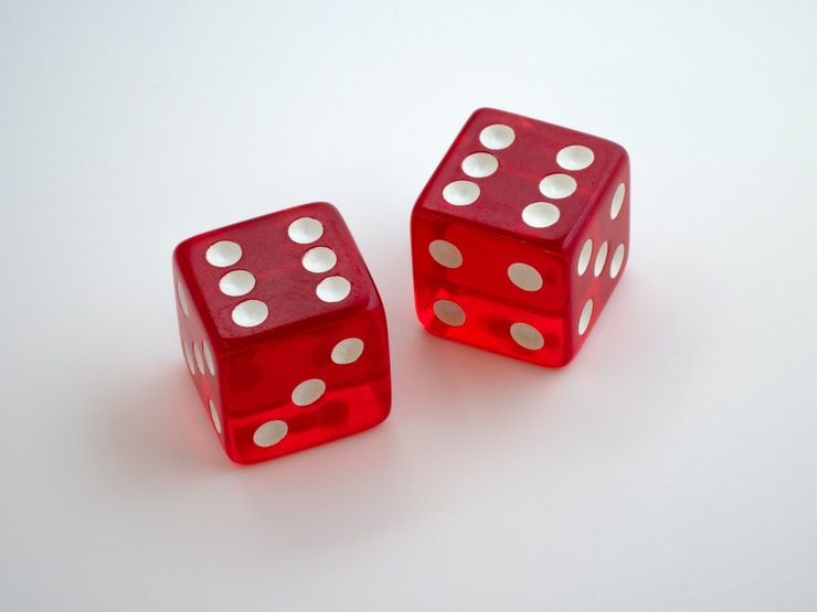 Two red dice, each showing the number 6.